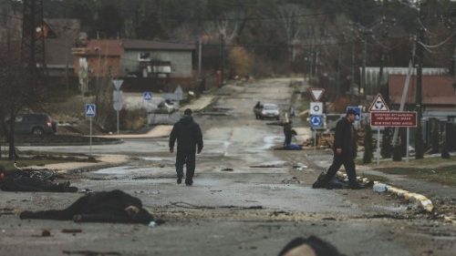 EDITORS NOTE: Graphic content / TOPSHOT - Bodies lie on a street in Bucha, northwest of Kyiv, as ...