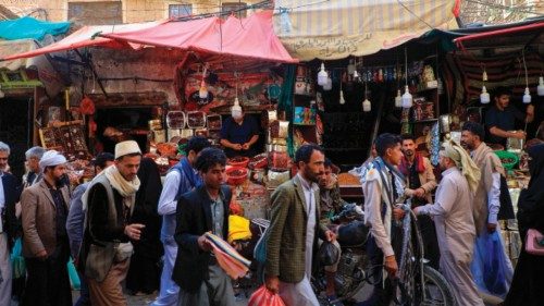 Yemenis shop at a market in the old city of the Yemeni capital Sanaa on the first day of the Muslim ...