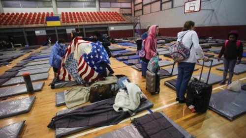 Ukrainians who fled to Mexico amid Russia's invasion of their homeland, arrive at a shelter to wait ...