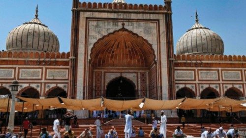 Muslim devotees perform ablution prior to offer Friday prayers during Islam's Holy month of Ramadan ...