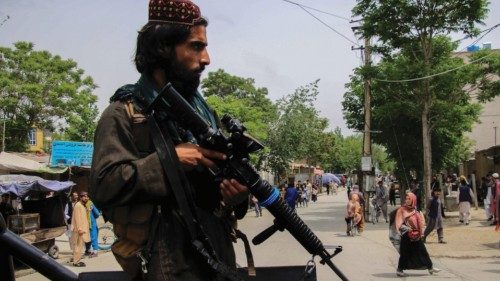 epa09896902 A Taliban stands guard in an area surrounding a school in the aftermath of multiple bomb ...