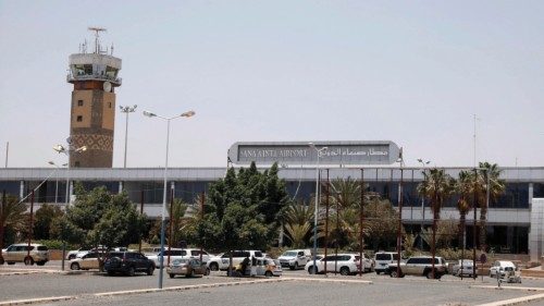 epa09885129 UN vehicles park at the shuttered Sanaâa airport with the control tower, in Sana'a, ...
