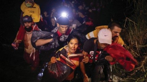 Yaquemile, a 48 year old migrant from Cuba, arrives onto U.S. soil after wading through the Rio ...