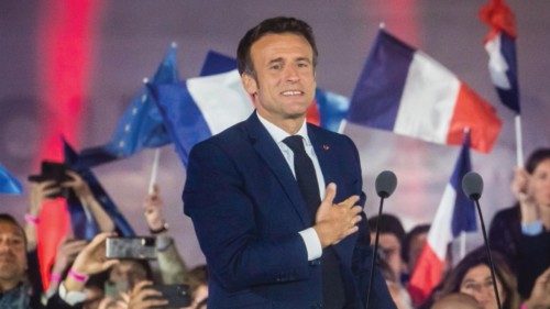 epa09907876 French President Emmanuel Macron reacts during his speech after winning the second round ...