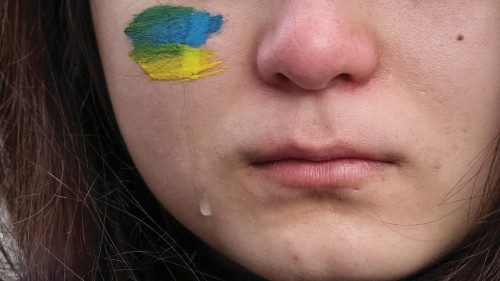 A woman cries as she takes part in a rally demanding international leaders to organise a ...