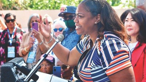 Lora King, daughter of the late Rodney King, addresses the crowd gathered near the intersection of ...