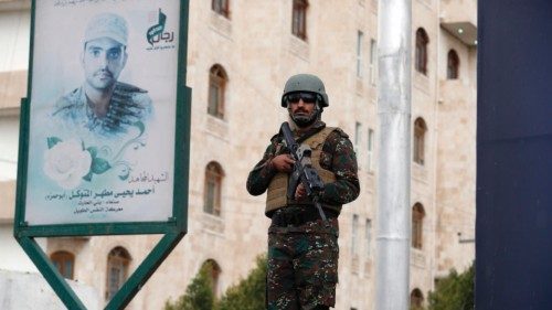 epa09917205 A Houthi fighter stands guard during a rally marking the Al-Quds Day on the last Friday ...