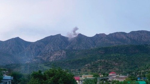 Smoke billows following reported Turkish warplane raids, from a site in the Matin Mountains near the ...