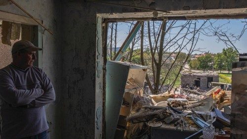 epa09930609 Serhii (64), looks at his damaged apartment after the recent Russian airstrike, in ...