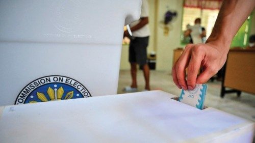 A man casts his vote during the presidential election at a polling station in Manila on May 9, 2022. ...