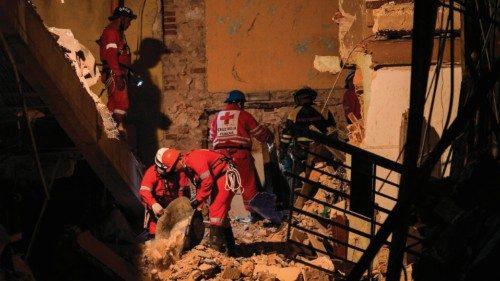Firefighters and rescue workers remove debris from the ruins of the Saratoga Hotel, in Havana, on ...