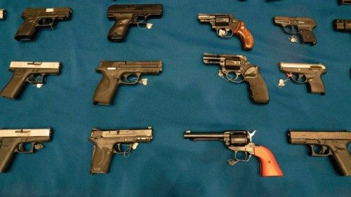 (FILES) In this file photo taken on October 05, 2021 confiscated guns are on display during a press ...