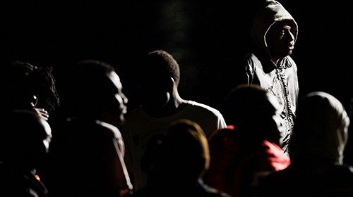 Migrants wait to disembark from a Spanish coast guard vessel, in the port of Arguineguin, in the ... Migrants wait to disembark from a Spanish coast guard vessel, in the port of Arguineguin, in the ...