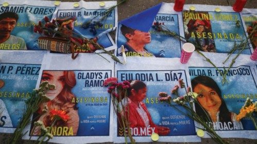 Flowers are placed on the images of murdered environmentalists during a protest on Earth Day to ... Flowers are placed on the images of murdered environmentalists during a protest on Earth Day to ...