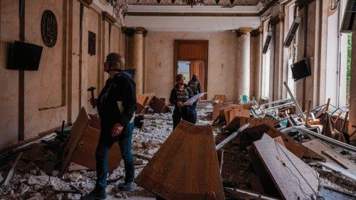 TOPSHOT - Construction engineers examine a damaged building of the Kharkiv Regional State ... TOPSHOT - Construction engineers examine a damaged building of the Kharkiv Regional State ...