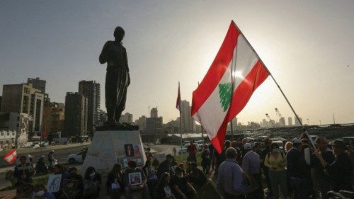 FILE PHOTO: Families of the victims of the 2020 Beirut port explosion hold pictures during a protest ...