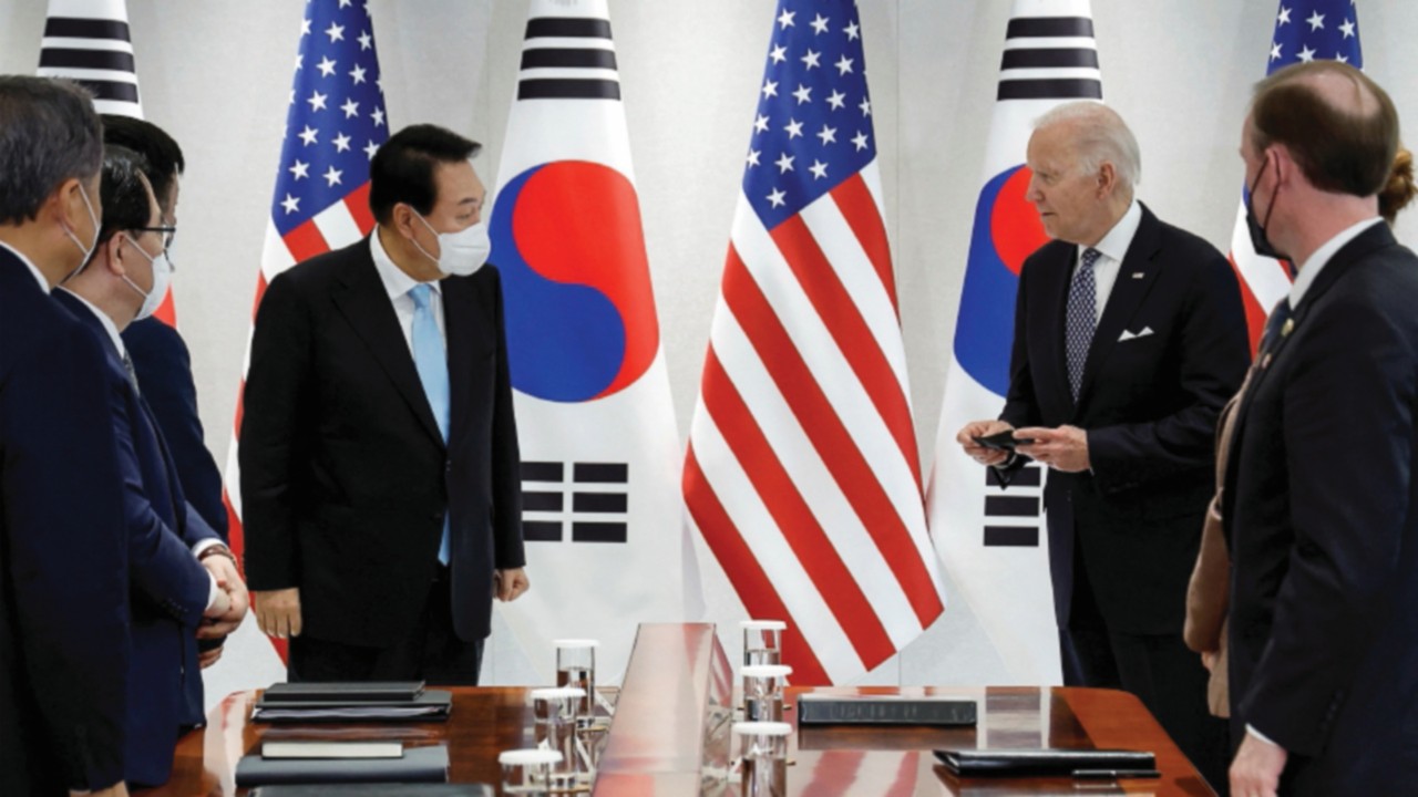 U.S. President Joe Biden interacts with South Korean President Yoon Suk-youl during a bilateral ...