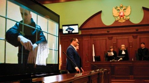 Opposition leader Alexei Navalny appears on a screen set up at a courtroom of the Moscow City Court ...