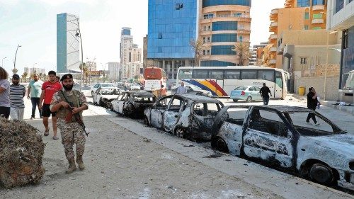 This picture taken on on May 17, 2022 in Libya's capital Tripoli shows a view of vehicles destroyed ...