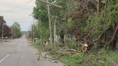 Damaged utility poles and trees are seen in the aftermath of a storm in Uxbridge, Ontario, Canada ...