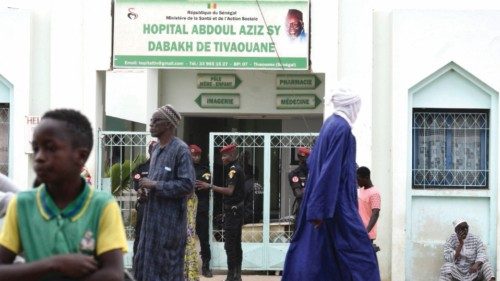 Visitors stand in front of the Mame Abdoul Aziz Sy Dabakh Hospital, where eleven babies died ...