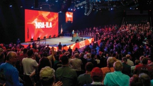HOUSTON, TEXAS - MAY 27: People listen to CEO and Executive vice president of the National Rifle ... HOUSTON, TEXAS - MAY 27: People listen to CEO and Executive vice president of the National Rifle ...