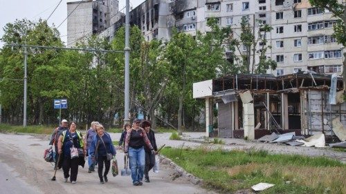 epa09978254 Locals arrive to clean a neighborhood from debris after new shelling in Kharkiv, ...