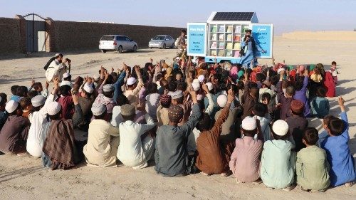 epa09956293 Afghan children attend an educational event organized by Pen Path, a civil society ...