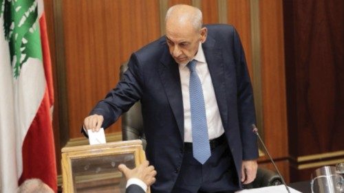 Lebanese Parliament Speaker Nabih Berri casts his vote as Lebanon's newly elected parliament ...