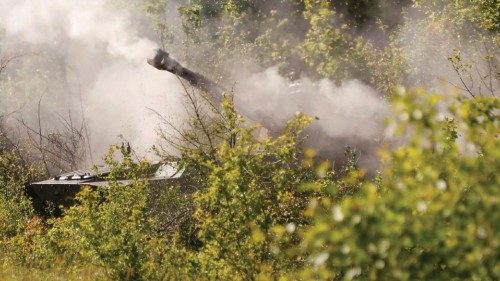 Smoke rises above a self-propelled howitzer 2S1 Gvozdika of pro-Russian troops, which fired a ...