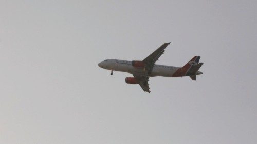 epa09989349 An Airbus A320 aircraft of Yemenia Airways flies over the city, getting ready to land at ...