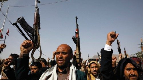 epa09994412 Houthi supporters shout slogans during an anti-US and Saudi Arabia protest, a day after ...