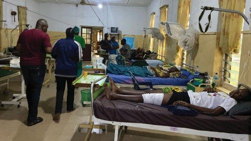 Victims of the bomb attack during a Catholic mass at St. Francis Catholic church receive treatment ...