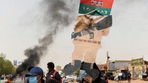 epa09994288 Sudanese protesters hold placards during a rally marking the third anniversary of a ...
