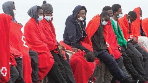 epa09989146 Red Cross members help some of the 172 Sub-Saharian immigrants that have been rescued ...