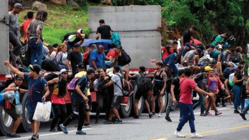 Migrants from Latin America taking part in a caravan towards the border with the United States ...