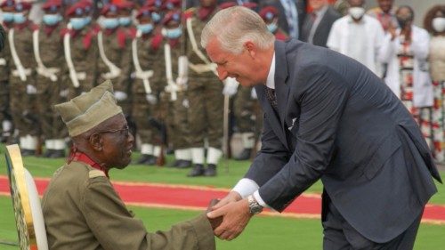 epa10002805 Belgium's King Philippe (R) shakes the hand of Democratic Republic of Congo Corporal ...