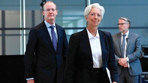 Christine Lagarde (C), President of the European Central Bank (ECB) and President of The Netherlands ...