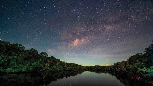 View of the night sky illuminating the Manicore river, located in the municipality of Manicore, ...