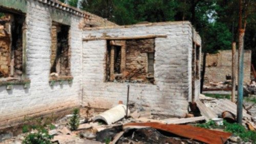 TOPSHOT - A Ukrainian flag waves over a house destroyed by shelling in the village of Moshchun, Kyiv ...