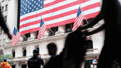 NEW YORK, NEW YORK - JUNE 03: People walk by the New York Stock Exchange (NYSE) at the start of the ...