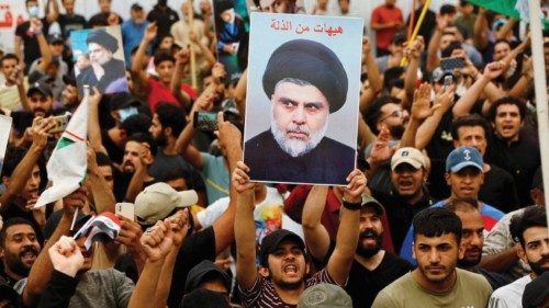 FILE PHOTO: Supporters of Iraqi Shi'ite Muslim cleric Muqtada al-Sadr shout slogans during a ...
