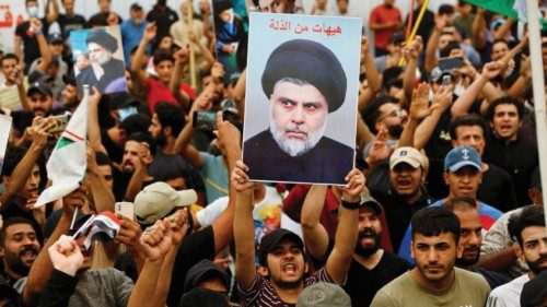 FILE PHOTO: Supporters of Iraqi Shi'ite Muslim cleric Muqtada al-Sadr shout slogans during a ... FILE PHOTO: Supporters of Iraqi Shi'ite Muslim cleric Muqtada al-Sadr shout slogans during a ...