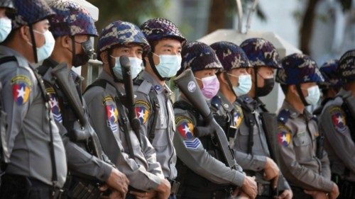 FILE PHOTO: Police stand guard as they wait for protests against coup in Yangon, Myanmar February 4, ... FILE PHOTO: Police stand guard as they wait for protests against coup in Yangon, Myanmar February 4, ...