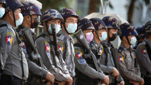 FILE PHOTO: Police stand guard as they wait for protests against coup in Yangon, Myanmar February 4, ...