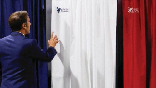 FILE PHOTO: French President Emmanuel Macron enters a polling booth to cast his vote during the ... FILE PHOTO: French President Emmanuel Macron enters a polling booth to cast his vote during the ...