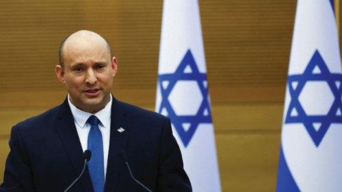 Israeli Prime Minister Naftali Bennett speaks next to Foreign Minister Yair Lapid (not pictured) as ...