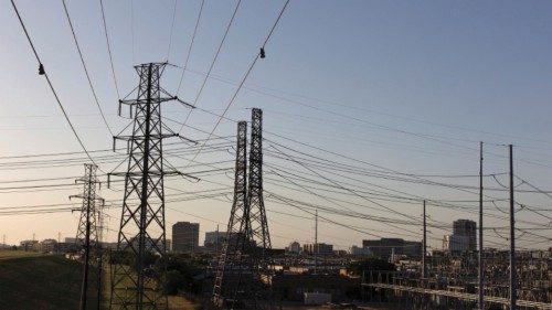 Power lines are seen during a heatwave with expected temperatures of 102 F (39 C) in Dallas, Texas, ...