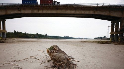 A tree trunk lies on Po's dry riverbed as parts of Italy's longest river and largest reservoir of ... A tree trunk lies on Po's dry riverbed as parts of Italy's longest river and largest reservoir of ...