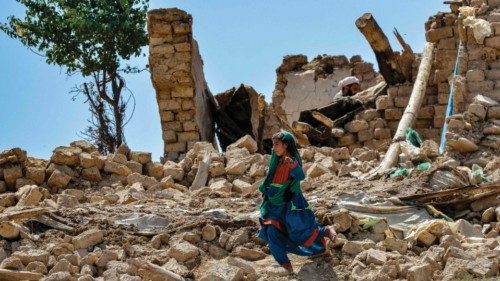 CORRECTION / A child walks amidst the rubble of damaged houses following an earthquake in Bermal ... CORRECTION / A child walks amidst the rubble of damaged houses following an earthquake in Bermal ...